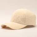 Detail of beige seersucker baseball cap showing textured bubble fabric and curved brim - Adjustable / Frilled-Beige