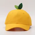 Detail of yellow cotton baseball cap featuring green leaf ornaments on the top crown - Adult / Yellow