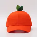 Close-up of creative orange fruit baseball cap with green leaf detail and stitched eyelets - Adult / Orange