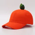 Vibrant orange baseball cap with 3D green leaf detail, cute citrus design for sun protection - Kids / Orange