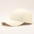 Detailed view of cream white baseball cap with 3D quilted wave pattern and curved brim - Diamond Pattern / Off White