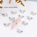 10pcs silvery white alloy butterfly nail charms with rhinestones on pink nails - Silver Base AB Rhinestone