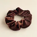 Detail of dark brown velvet scrunchie showing fabric texture and soft pleats - Brown