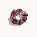 Detailed view of dark red plaid scrunchie with woven texture and ruffled design - Goldfish Red Plaid