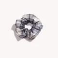Detailed view of blue and white plaid fabric scrunchie with soft ruffled texture - Gentle Blue Plaid