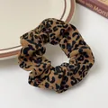 Classic leopard print scrunchie in brown and black tones with textured ribbed fabric - Leopard Brown
