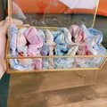 Detailed view of colorful plaid scrunchies set stored in a gold-framed glass box - 10 Pieces Pack / Colorful Grains