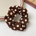 Deep brown hair scrunchie with white polka dots pattern and soft knitted fabric texture - Brown Cow Print