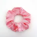 Macro view of silky light pink satin scrunchie with soft fabric pleats on white background - Satin 19