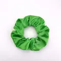 Detailed close-up of emerald green satin scrunchie showing smooth silk-like fabric texture - Satin 29