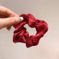 Elegant deep red organza scrunchie with silky satin texture and elastic band - Burgundy