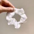 Elegant white organza scrunchie with pearlescent finish for stylish ponytails - White