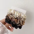 Set of 4 premium satin scrunchies in cream, brown, and black tones for hair styling - Five Color Style