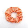 Minimalist coral orange satin scrunchie with a glossy silk texture on a white background - Satin 10