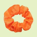 Vibrant orange satin scrunchie with smooth silk texture and elastic pleated fabric design - Bright Orange
