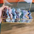 Set di elastici per capelli a scacchi colorati in scatola di vetro con bordi dorati - Città Silenziosa