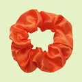 Elastic bright orange satin scrunchie with smooth silk-like texture for ponytails - Vibrant Orange