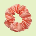 Elastic coral pink satin scrunchie with soft silk texture and elegant pleated design - Coral Pink