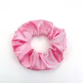Pink satin scrunchie hair tie with glossy finish and elegant fabric texture folds - Satin 21