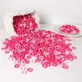 Close-up of bulk pink seamless high-elastic hair ties spilling from a woven basket - Pink Series
