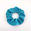 Glossy peacock blue satin scrunchie with pleated texture on white background - Satin 25