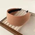 Close-up of caramel knit headband showing ribbed texture and black anti-slip lining - Chocolate