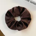 Macro shot of dark brown corduroy hair scrunchie showing detailed ribbed texture - Dark Coffee