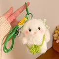Detail of white plush bunny keychain with green bows, clover bag and woven lanyard - Clover Bag Bunny