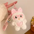 Close-up of plush rabbit keychain with pink bow and glasses accessory for bags - Pink Apron Bunny