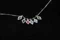 Close-up of S925 sterling silver rhombic pendants with colorful zircon inlay on a fine chain - Diamond-Black
