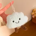 Close-up of light blue plush cloud charm with smiling face and dangling legs - Hanging Chain Style / Blue
