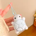 Close-up of a small plush turtle keychain with soft blue shell held in hand - Blue Little Turtle / Light Blue