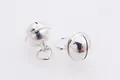 Macro shot of two polished silver bell pendants with ringing sound for DIY jewelry making - 8mm