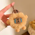 Gros plan d'un porte-clés capybara en peluche marron avec crochet en métal et clochette - Style Capybara Brun avec Clochette (F-4570)