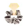 Detail view of silver grey satin silk scrunchie on decorative hexagonal paper card - Gray