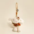 Detail van een pluche konijnenhanger met een bruine gebreide trui en een rood hart - Bruin konijntje met hartjestrui en gebreid bloemetje (Konijn Stijl 3)