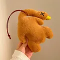 Detailed view of a soft brown plush duck keychain with cross-stitch eyes and a yellow beak - Large (With Lanyard) / Brown