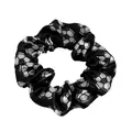 Detailed view of black satin scrunchie featuring silver football soccer ball pattern prints - Black Soccer