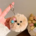 Detailopname van een pluizige hamster sleutelhanger met gekleurde sterren en metalen ketting - Lichtbruine Sterknop (Stijl 2)