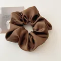 Detail of elegant dark brown satin scrunchie with smooth texture and soft pleats - Dark Coffee