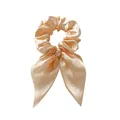 Elegant champagne satin scrunchie with long ribbon bow for a stylish ponytail look - Off-white