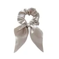 Detail of silk satin scrunchie with long bow ribbons in elegant champagne color - Gray