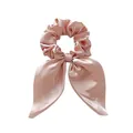 Detailed view of champagne pink satin bow scrunchie with long ribbons and silky texture - Dusky Pink