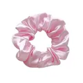 Close-up of a soft pink satin scrunchie with a silky texture and elegant fabric folds - L / Pink