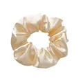 Close-up of champagne satin scrunchie showing glossy fabric texture and elegant pleats - L / Off White