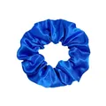 Close-up of a royal blue satin scrunchie with a silky texture and ruffled finish - Satin Royal Blue