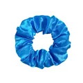 Close-up of a bright blue satin scrunchie with silky texture and smooth pleated design - Satin Bright Blue