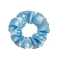 Close-up of a light blue satin scrunchie showing glossy fabric texture and elastic pleats - Satin Light Blue