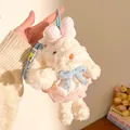 Close-up of white plush bunny keychain with pink lace dress and blue bows detail - Pink And Blue Double Bow Rabbit