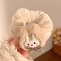 Close-up of plush beige scrunchie featuring a cute white bunny with a plaid bow tie - Brown Rabbit Brown Scrunchie